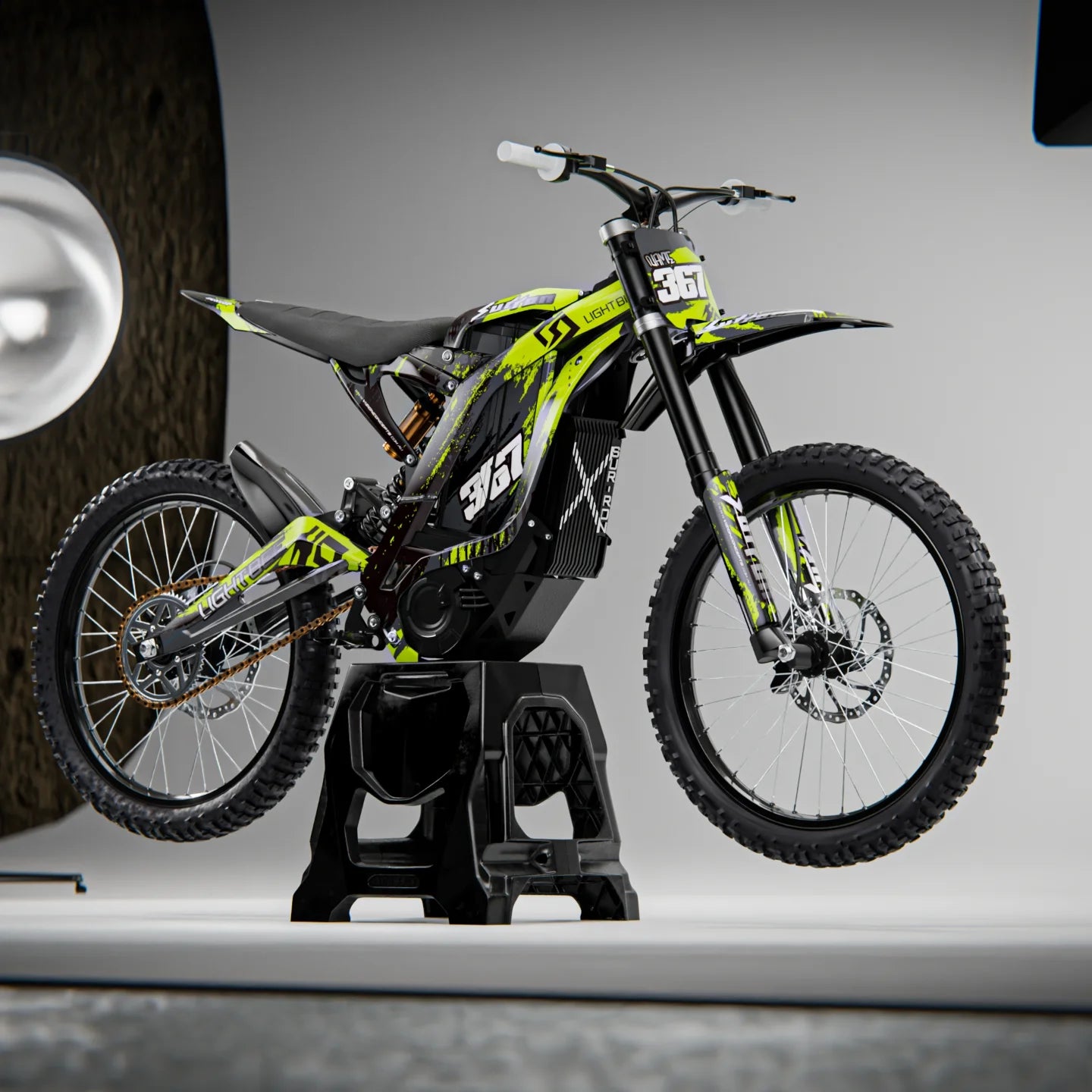 Yellow and black dirt bike on a stand with a neutral background