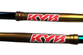 Two KYB shock absorbers on a white background