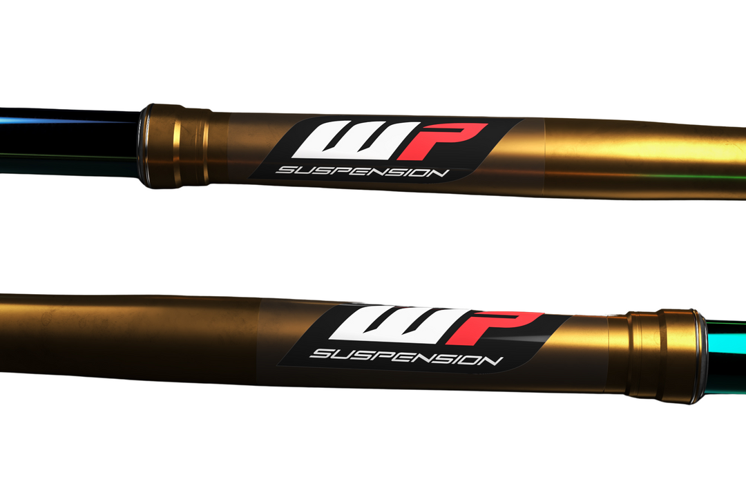 Two gold suspension forks with WP Suspension branding on a white background